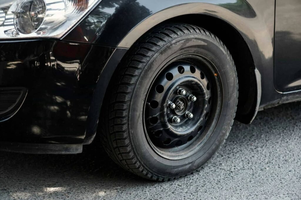 The image in front of the black car's wheel - Tyre Shop Singapore | Tire Pte Ltd Hybrid tyres | tyre shop singapore | tire pte ltd